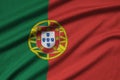 Portugal flag is depicted on a sports cloth fabric with many folds. Sport team banner Royalty Free Stock Photo