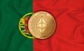 Portugal flag ethereum gold coin on flag background. The concept of blockchain bitcoin currency decentralization in the country