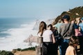 Portugal. A group of people or tourists admire the sights and take pictures of the beautiful view of Cape Roca Royalty Free Stock Photo