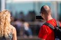 Portugal, Lisbon, October 08, 2018: Man, a tourist with smartphone, explores new places and shoot photos and makes a video
