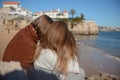 Portugal Lisbon two girls on the beach hug each other Royalty Free Stock Photo