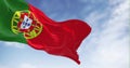 Slow motion loop of Portugal national flag waving in the wind on a clear day