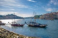 Portugal, city landscape Porto, a group of yellow wooden boats with wine port barrels on Douro river Royalty Free Stock Photo