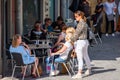 Portugal, Porto, October 06, 2018: Three women at cafe outdoor ready for talking and drinking wine