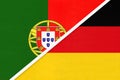 Portugal and Germany, symbol of national flags from textile. Championship between two European countries