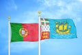 Portugal and Saint Pierre and Miquelon two flags on flagpoles and blue sky