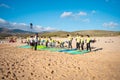 Portugal, Sintra, August 2022 Praia da Guincho Group of surfboard students training to ride waves