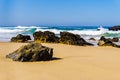 Portugals sandy beach on rocky Atlantic coast. Adraga beach Royalty Free Stock Photo