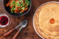 Portuguese cuisine. Alentejo style pork with porto sweet wine and a chicken pie Royalty Free Stock Photo