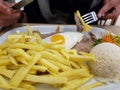 Portuguese cuisine, beef with fried egg and french fries called bitoque Royalty Free Stock Photo