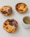 3 Portuguese custard tarts Pastel de Nata and espresso coffee