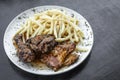 Portuguese famous piri piri spicy bbq chicken with french fries Royalty Free Stock Photo