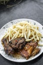 Portuguese famous piri piri spicy bbq chicken with french fries Royalty Free Stock Photo