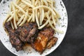 Portuguese famous piri piri spicy bbq chicken with french fries Royalty Free Stock Photo