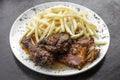 Portuguese famous piri piri spicy bbq chicken with french fries Royalty Free Stock Photo