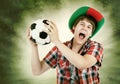 Portuguese fan loudly shouts on the Brazilian colors background Royalty Free Stock Photo