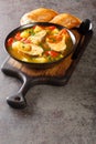 Portuguese fish stew Caldeirada de Peixe close-up in a bowl. Vertical