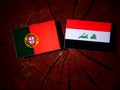 Portuguese flag with Iraqi flag on a tree stump isolated Royalty Free Stock Photo