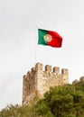 The Portuguese Flag is Pictured Over Sao Jorge Castle Royalty Free Stock Photo