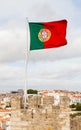The Portuguese Flag is Pictured Over Sao Jorge Castle Royalty Free Stock Photo