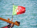 Portuguese flag by the sea in Porto, Portugal Royalty Free Stock Photo