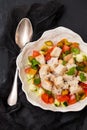 Portuguese gaspacho with bread in white bowl on black ceramic ba Royalty Free Stock Photo