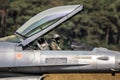 Portuguese military pilot with it\'s helmet on in the cockpit of a F-16 fighter jet