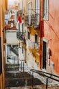 Portuguese old street. Hanging laundry at Sunset in the historical downtown of Lisbon, cityscape of Lissabon Royalty Free Stock Photo