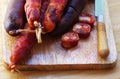 Portuguese sausage chourico and knife Royalty Free Stock Photo