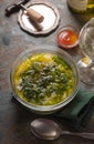 Portuguese soup Caldo Verde on the stone background vertical