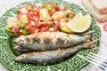 Portuguese style grilled sardines with salad Royalty Free Stock Photo