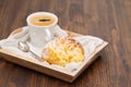 Portuguese sweet bread pao de deus with cup of coffee