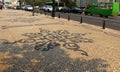 Portuguese traditional mosaic on the sidewalk in Lisbon