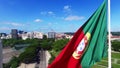 Portuguese Waving Flag in Eduardo VII Park in Lisbon, Portugal aerial view