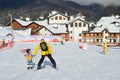 Posa Khutor, Sochi, Russia, January, 26, 2018. The instructor teaching little boy to go skiing on the child`s training slope in th