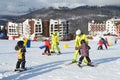 Posa Khutor, Sochi, Russia, January, 26, 2018. The instructor teaching little boys to go skiing on the child`s training slope in t