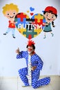 Pose of the colorful clown Mineirinho on the panel dedicated to World Autism Day