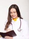 She poses in a doctor`s coat. With a book where she writes down her obligations. Ph2