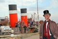 Posh gent boarding paddle steamer