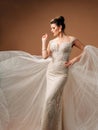 Posh lace wedding dress. Gorgeous model bride in luxury mermaid wedding gown. Royalty Free Stock Photo