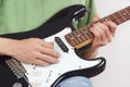 Posing hands of rock musician playing the electric guitar Royalty Free Stock Photo