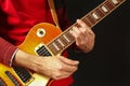 Posing hands of the rock musician playing the electric guitar on dark background Royalty Free Stock Photo
