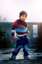 Posing in Style Cute Little boy child standing on roof Royalty Free Stock Photo