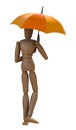 Posing wooden manikin with umbrella.