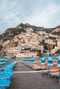 Positano beach with umbrella beds with Amalfi crags in background