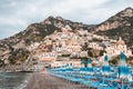 Positano beach with umbrella beds with Amalfi crags in background