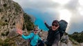 Positano - Couple with aerial panoramic view on the coastal road of the Amalfi Coast in the Provice of Salerno in Campania, Italy Royalty Free Stock Photo