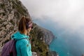 Positano - Woman with aerial panoramic view on the coastal road of the Amalfi Coast in the Provice of Salerno in Campania, Italy Royalty Free Stock Photo