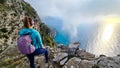 Positano - Woman with aerial panoramic view on the coastal road of the Amalfi Coast in the Provice of Salerno in Campania, Italy Royalty Free Stock Photo