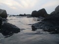 The position of the seafront stone pair to withstand the beach waves Royalty Free Stock Photo